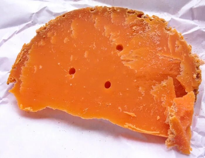 Star orange cheese. Сыр с оранжевыми пятнами. Кусочек сыра. Star orange cheese. Сыр с оранжевой корочкой.
