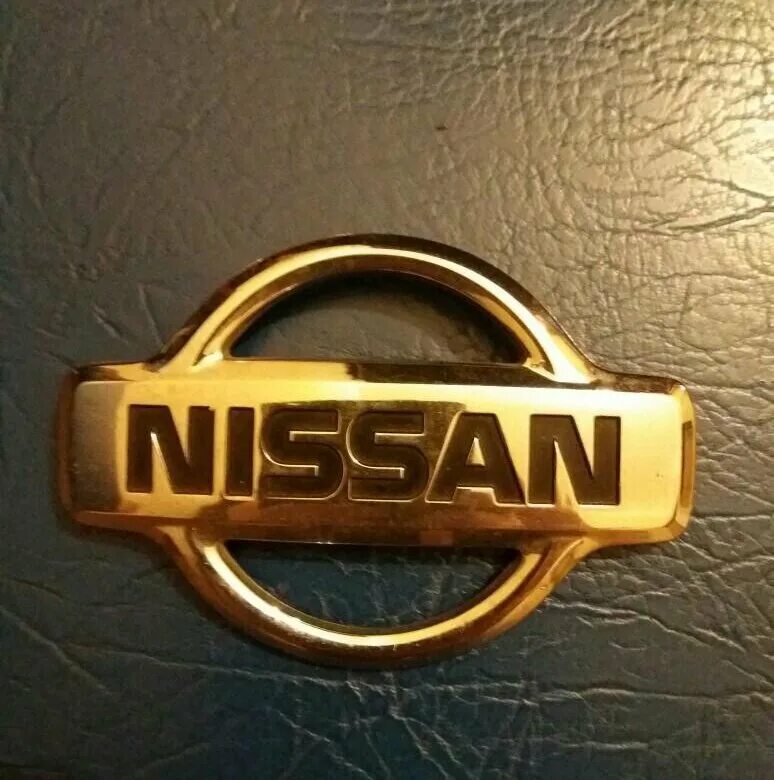 Эмблема nissan tiida хэтчбек. Эмблема ниссан на заставку телефона. Nissan 62890-em30a. Ниссан логотип. Nissan motor логотип.