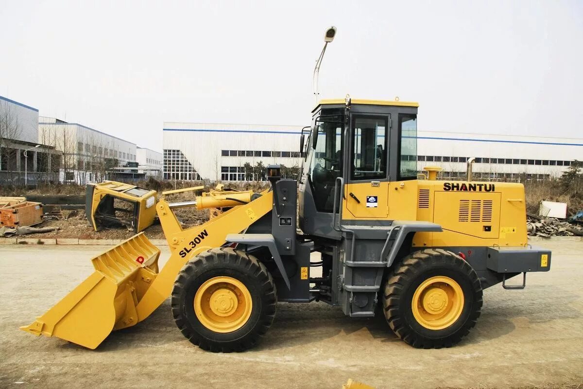 Фронтальный погрузчик sl30w. Shantui sl60w погрузчик. Фронтальный погрузчик shantui sl30w. Фронтальные погрузчики шантуй фото. Шантуй погрузчик фронтальный сл 30.