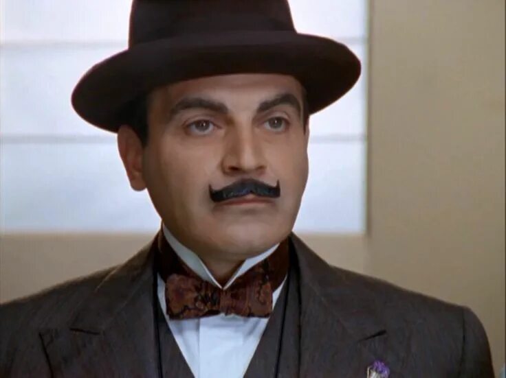 Hastings gets told... again. Chap just can't win. Poirot looks a tad guilty. Aga