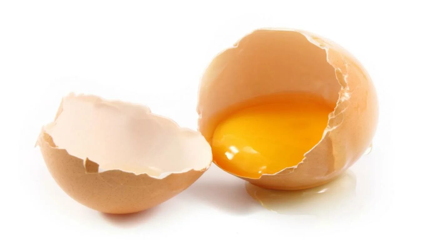 Разбитое яйцо. Яичный желток. Желток куриного яйца. Сырое яйцо.