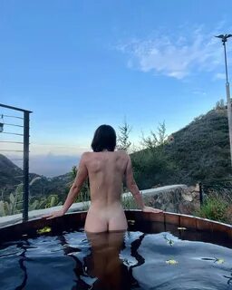 Scout Willis naked in a hot tub with her butt facing the camera. 