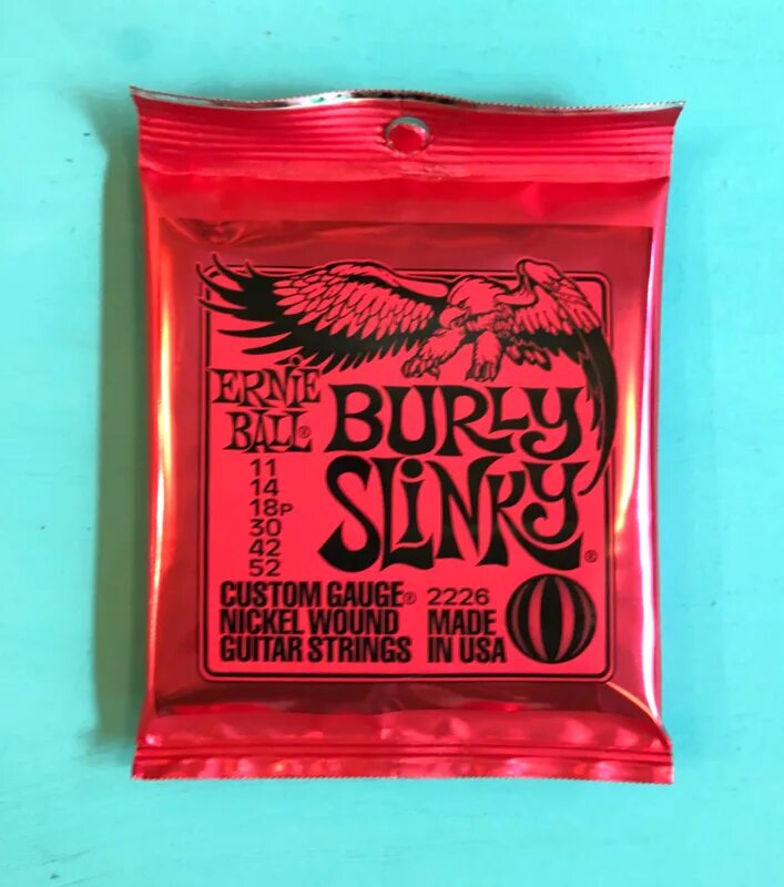 Ernie ball 11. Ernie ball burly slinky 11-52. ernie ball 9135. ernie ball 11-52. ernie ball 11 акустика.