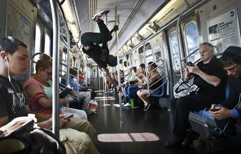 Dashawn Martin performs on a subway car in New York.The Associated Press. 