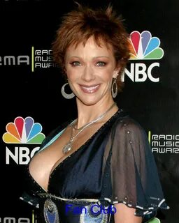 Lauren holly breast implants