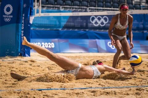 Brandie Wilkerson looks on as Canada teammate Heather Bansley goes all out ...