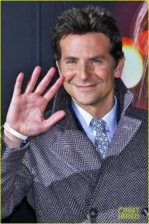 Bradley Cooper happily waves to fans while hitting the stage at the Japan.....