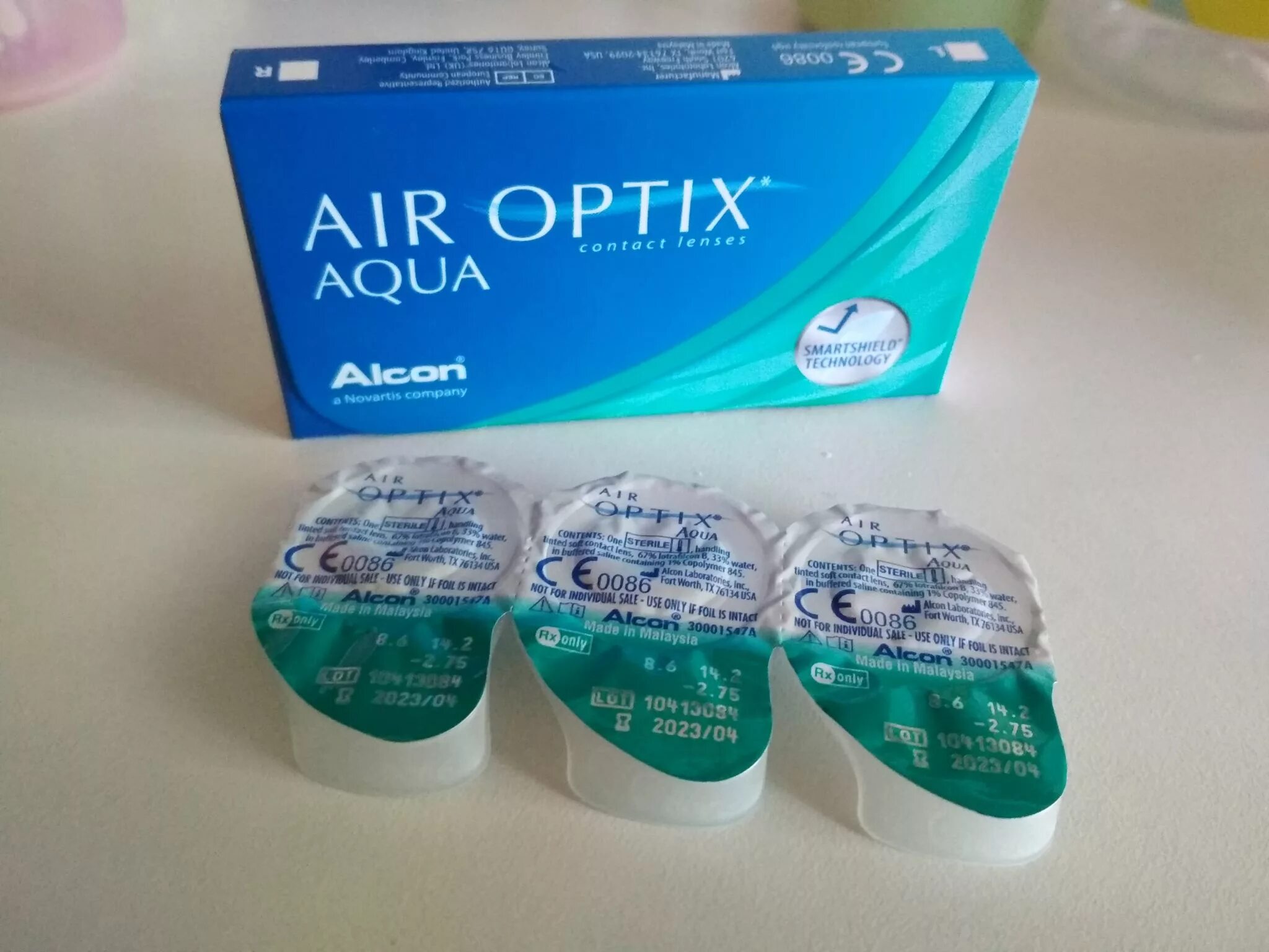 Купить линзы на озоне. АИР Оптикс Аква линзы 3 линзы. Air Optix Aqua (3 линзы). Air Optix -5.50 линзы. Линзы в блистере Air Optix.