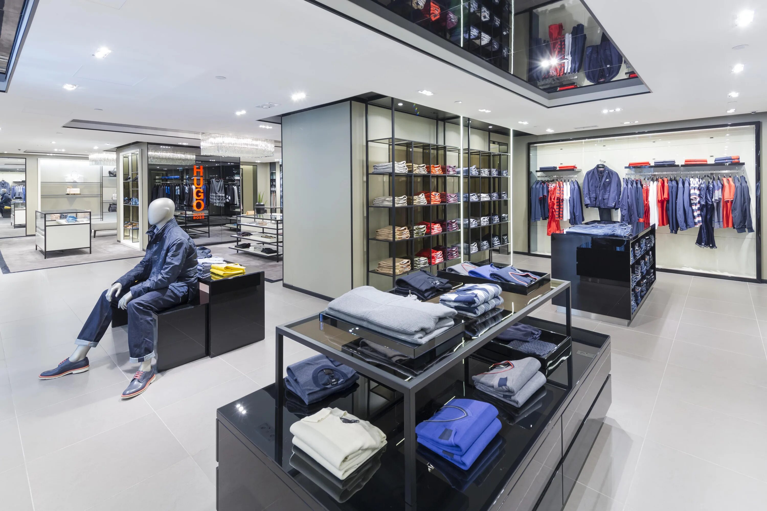 в модном магазине. стильная гардеробная комната. магазин модной мужской одежды. интерьер магазина одежды. товары для мужчин магазины.