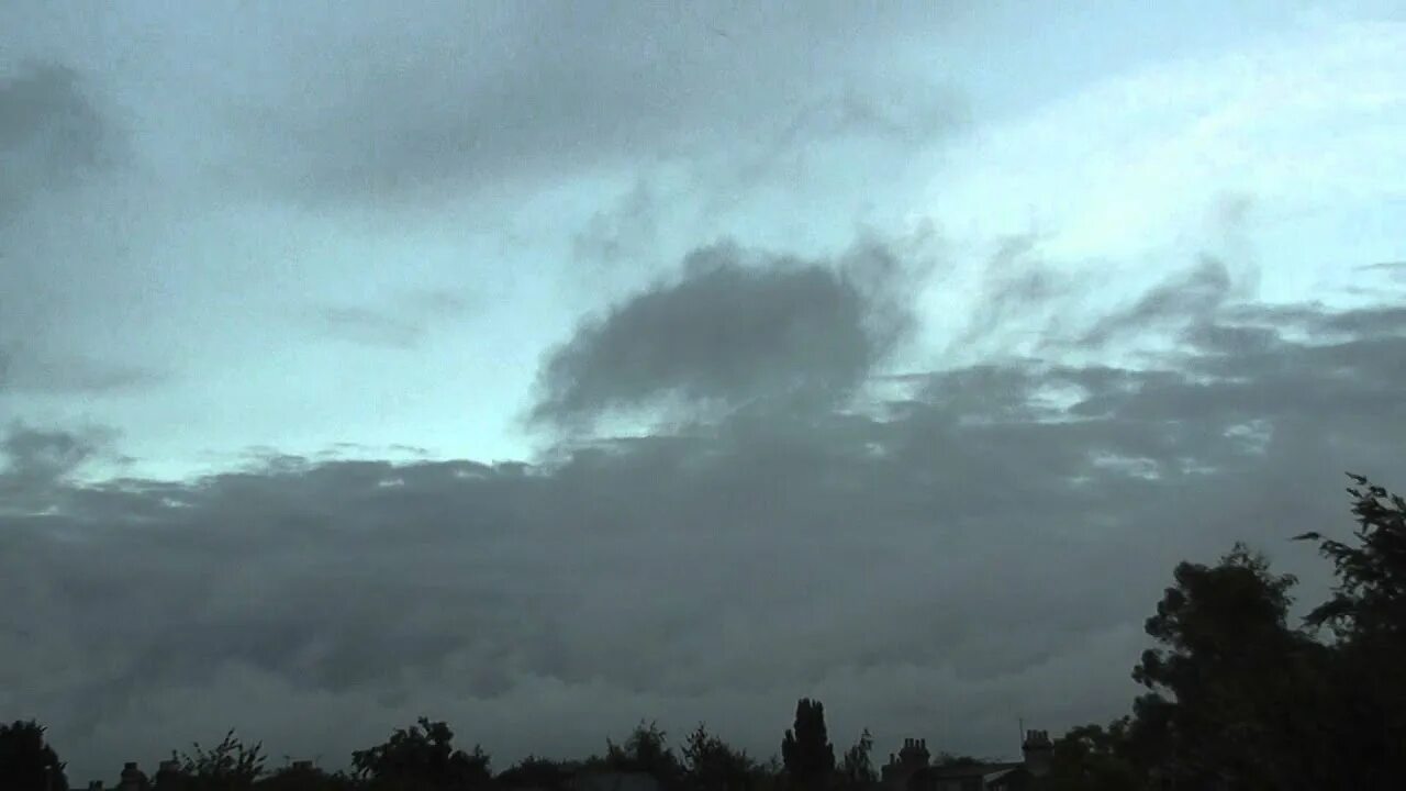 Passing cloud. Rain cloud omori. в облачную погоду вид на остров с высоты.