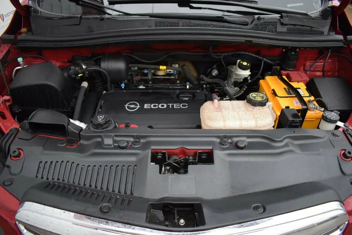 Какой двигатель опель мокка. АКБ Опель Мокка 1.4 турбо. АКБ Opel Mokka 1.8 2013г.. Опель Мокка 1.8 автомат. Аккумулятор для Опель Мокка 2014 1.4 турбо.