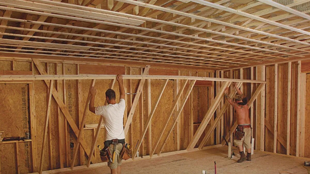The framing process is. Double-stud advanced framing walls. a tall building a stone building a wooden.