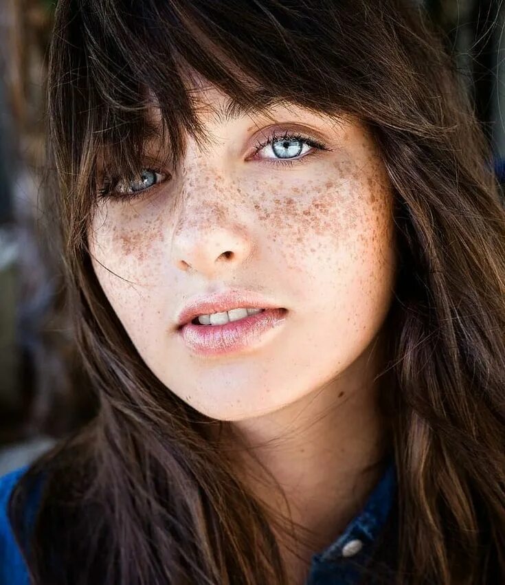 "Big green eyes, freckles, sly look, ." image created in Shedevrum