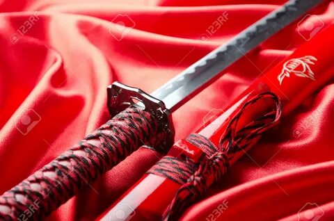 Japanese sword takana on red satin background - 14275308 