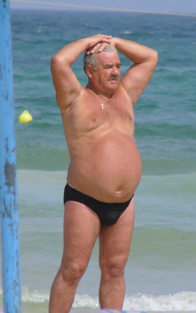 Grandpa Beach. Old man in speedo. Fat grandfather on the Beach.