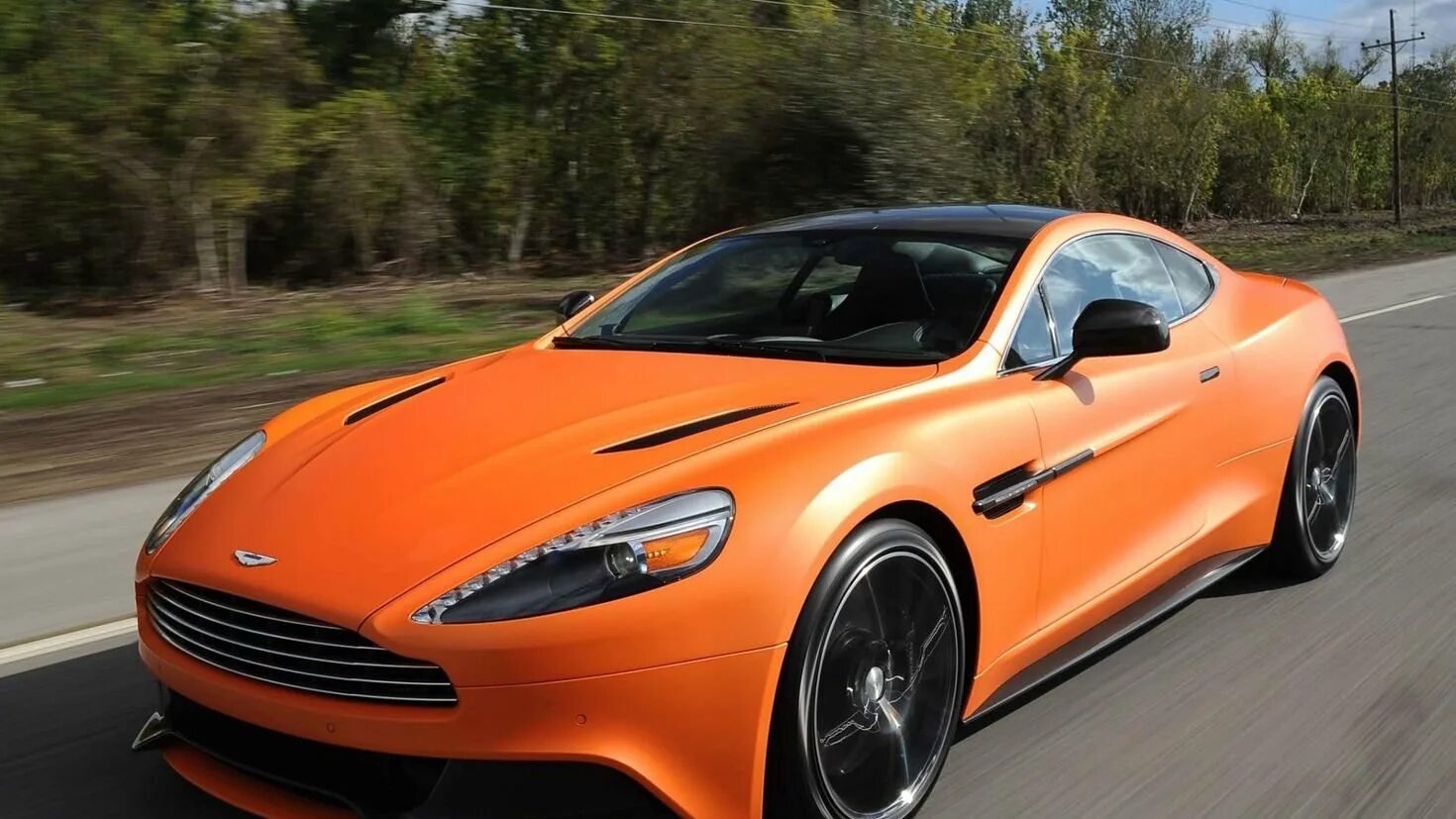 Спокойные машины. Автомобиль Астин Марти. Aston Martin Vanquish 2012.