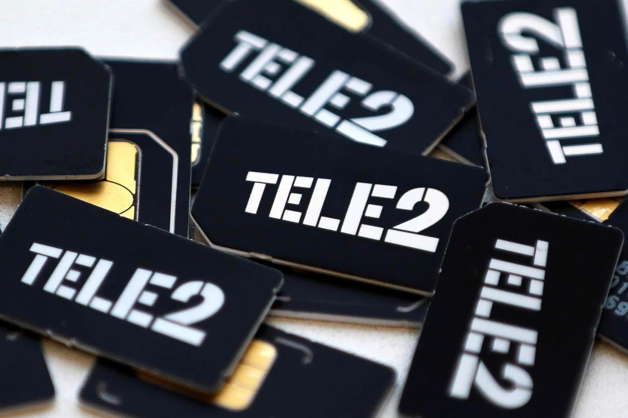 Какой мобильный оператор теле2. Сим карта теле2. Теле2 фото. Tele2 лого. Логотип оператора теле2.