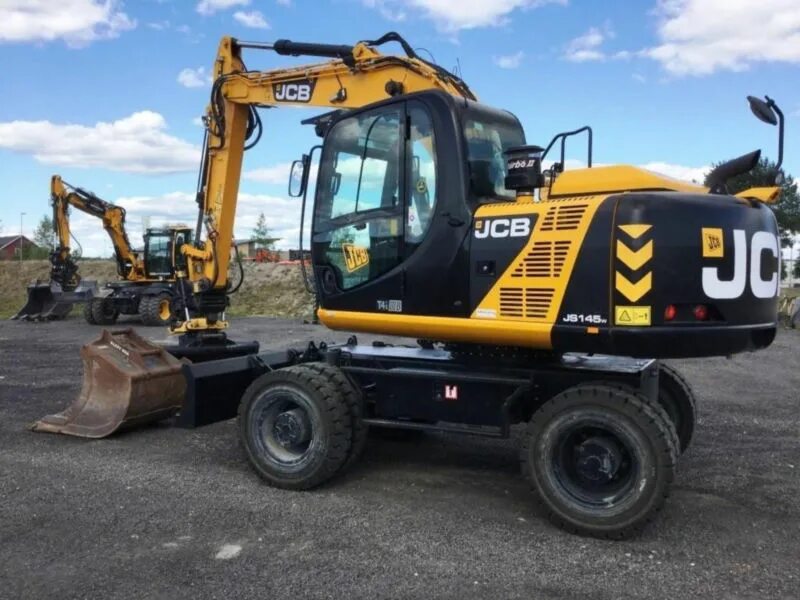 Jcb экскаватор купить б у. JCB js145w. JCB js 145. Колесный экскаватор JCB js 145w. JCB 145 колесный экскаватор.