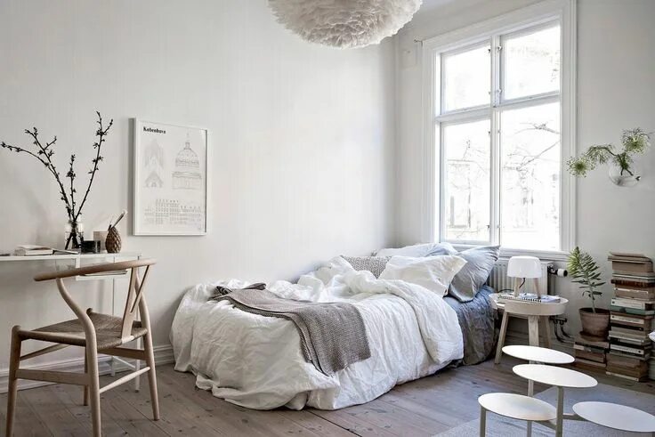 Awesome home studio, polka dotted planter, big windows, and cool wooden wall art