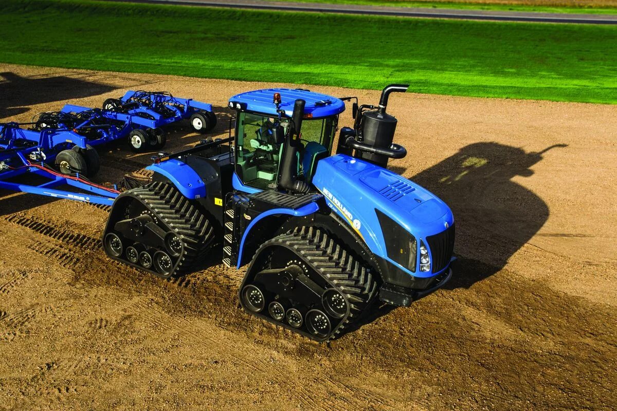 New holland t. Трактор New Holland. Трактор Нью Холланд т9. Трактор т9040 New Holland. Трактор Нью Холланд т 9000.