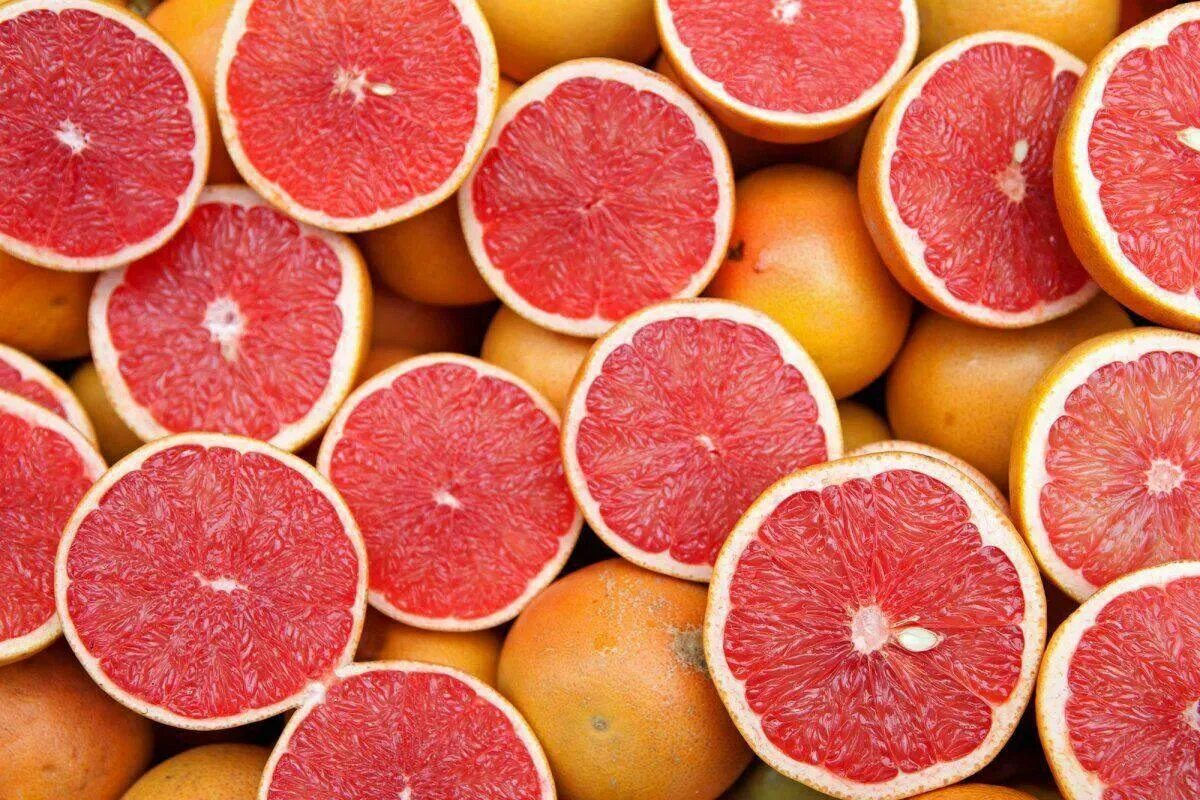 Картинки грейпфрута. Грейпфрут ЮАР. Розовый грейпфрут. Апельсин грейпфрут помело. Сочный грейпфрут.