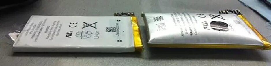 Вздутый аккумулятор iphone 5s. Вздутие аккумулятора телефона. Вздулся аккумулятор в телефоне. Вздутие аккумулятора телефона. Вздутый аккумулятор.