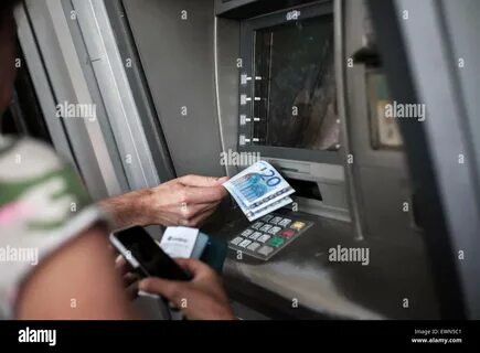 Women withdraw money from citibank ATMS in London, United Kingdom, 17 March...