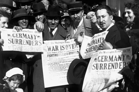 D.C., show newspaper headlines which falsely announce Germany' surrend...