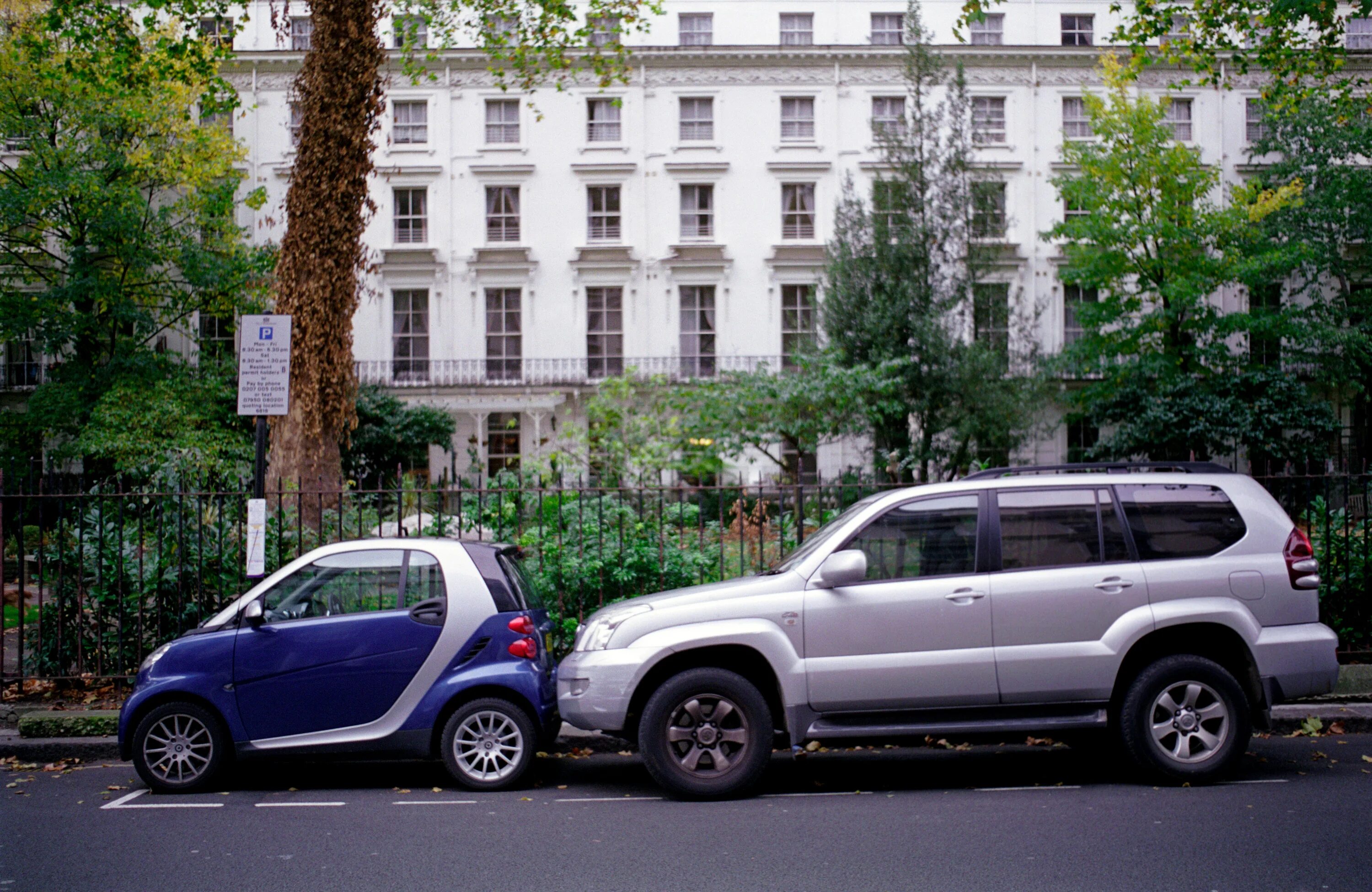 Big and small cars. Smart car parking. Car Park owner. Big car small car. A very big car