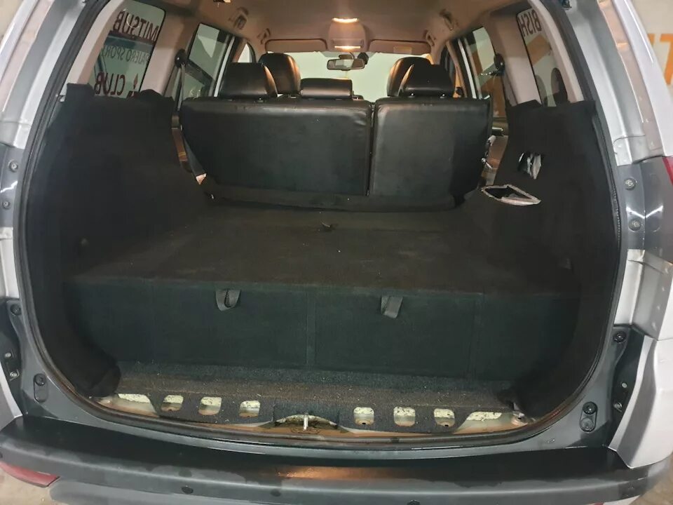 Дверь мицубиси паджеро спорт. Багажник Паджеро спорт 2. Багажник Митсубиси Паджеро спорт 1. Mitsubishi Pajero Sport 2014 багажник. Паджеро спорт 2021 багажник.