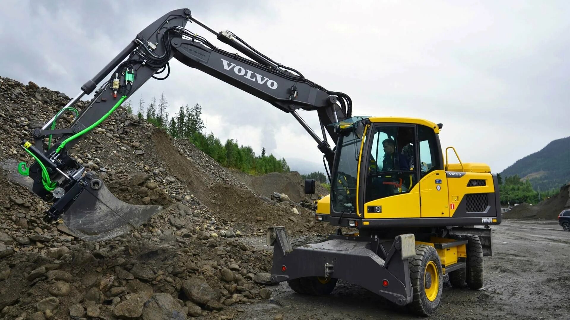 Volvo ew140. Volvo EW 180 E. Volvo 750 экскаватор. Volvo ec170d. Колесный экскаватор вольво