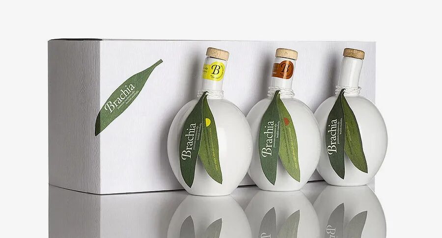 Оливковое масло упаковка. Упаковка для бутылки оливкового масла. Красивая упаковка масла оливкового. Оливковое масло этикетка.