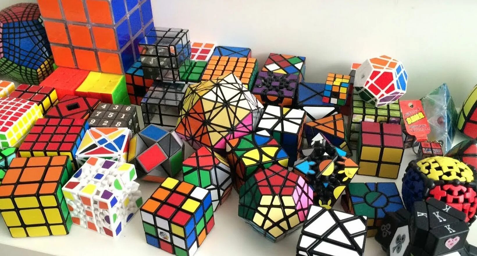 День головоломок. Rubiks Cube 9x9. 2x2 кубик Рубика и 3х3х3. Необычные кубики рубики. Кубик Рубика нестандартный.
