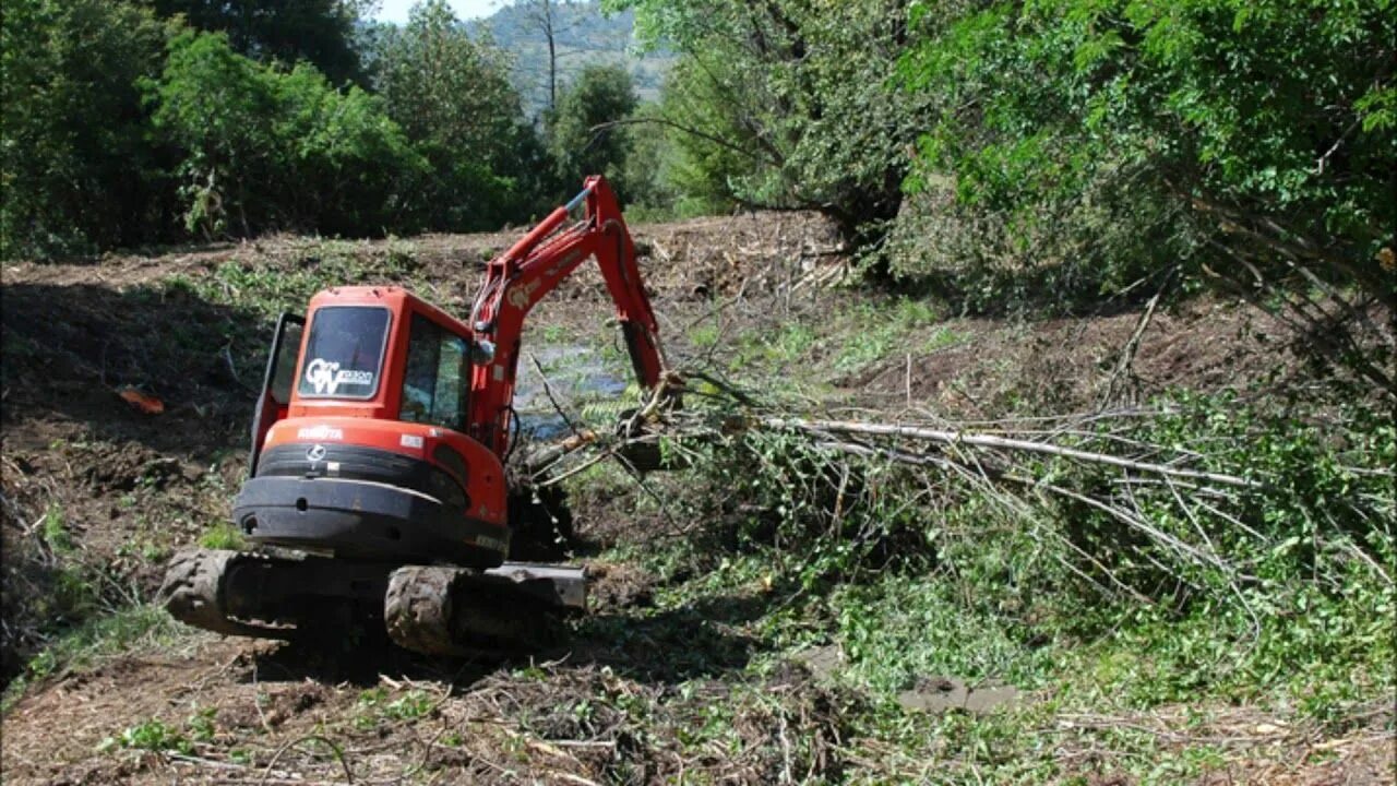 Clearing land. Land clearing. Land clearing and Leveling Machines. Best Land clearing attachment- the Intimidator - Danuser. Junk Land.