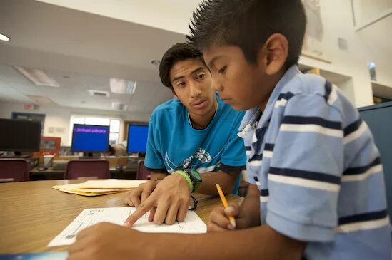 Tutor student. UC Davis scholarship. Tutor and his student.