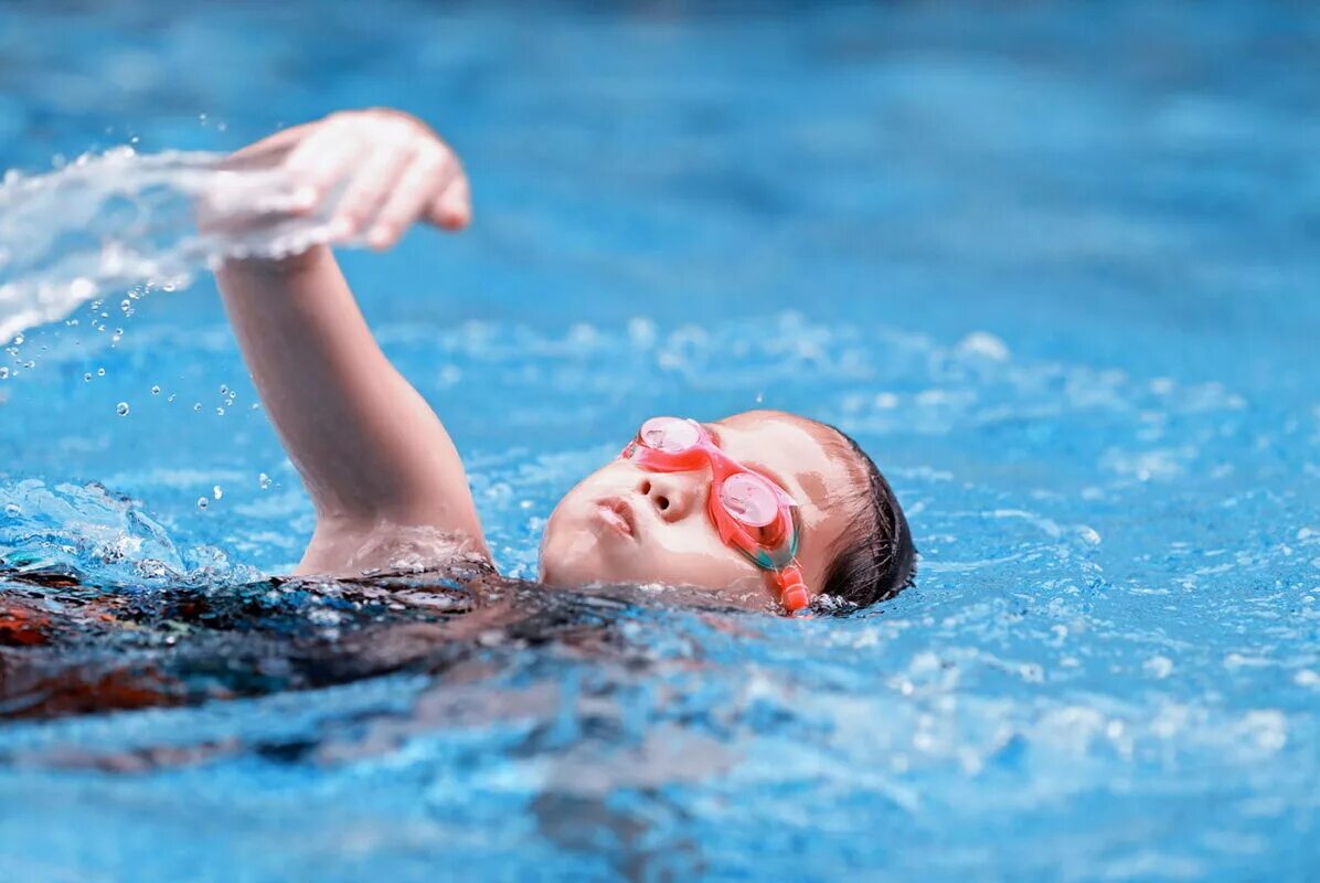 He swims in the pool