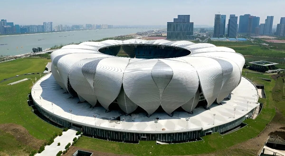Стадионы китая. Стадион чи Джонг в Шанхае архитектура. Стадион в Ханчжоу. Стадион Китай 2023. Арена в Шанхае Джонг.