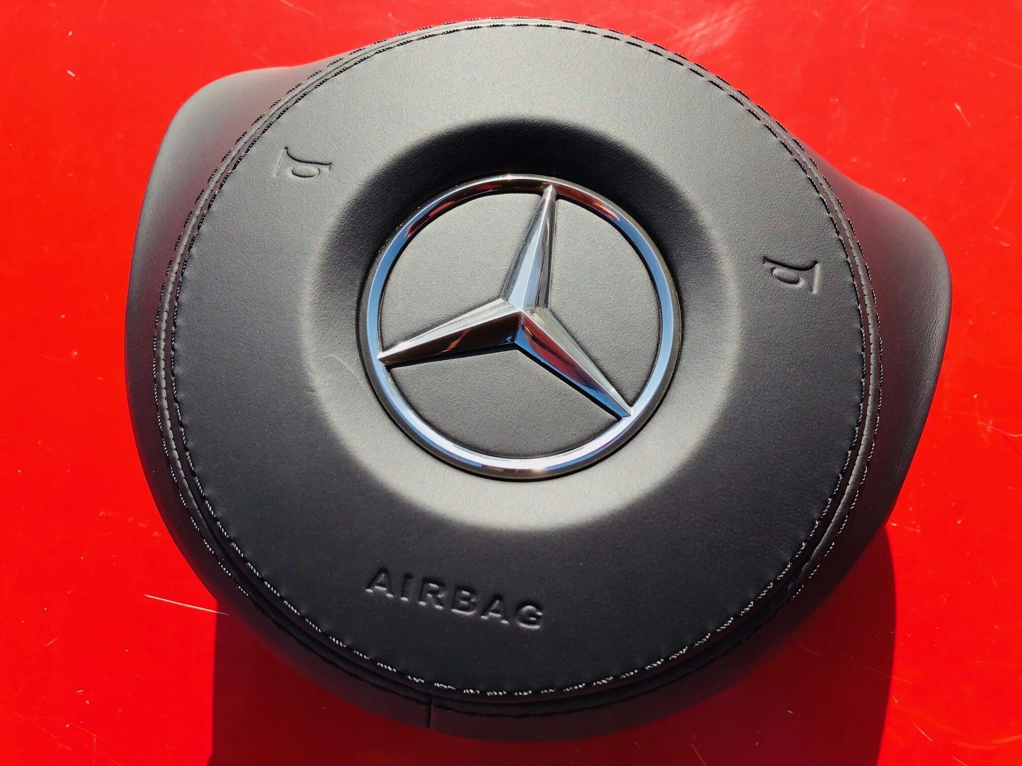 Подушки мерседес купить. Mercedes airbag. Крышка airbag w205. Крышка аирбаг руля w205. Подушки безопасности Мерседес CLA.