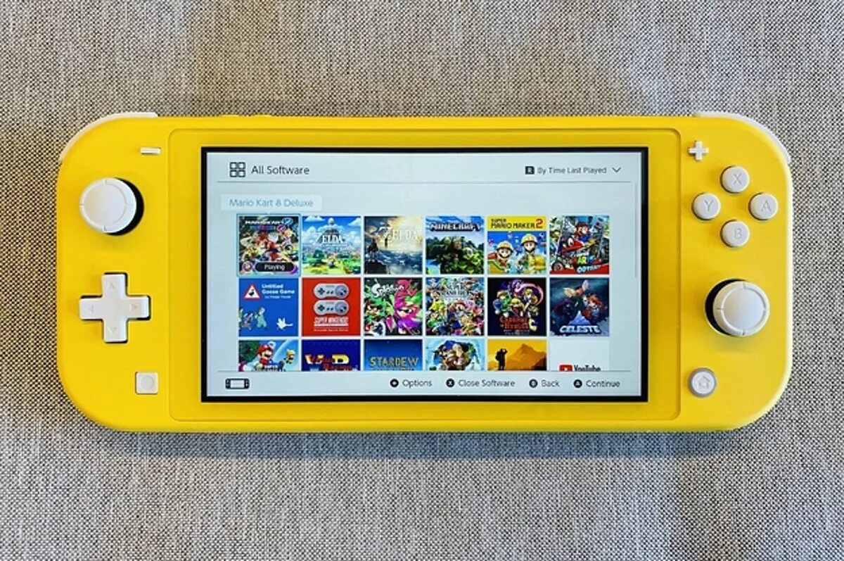 Nintendo lite купить прошитую. Нинтендо свитч Лайт. Нинтендо свитч Лайт желтый. Nintendo Switch Lite игры. Нинтендо свитч Лайт super Mario maker 2.