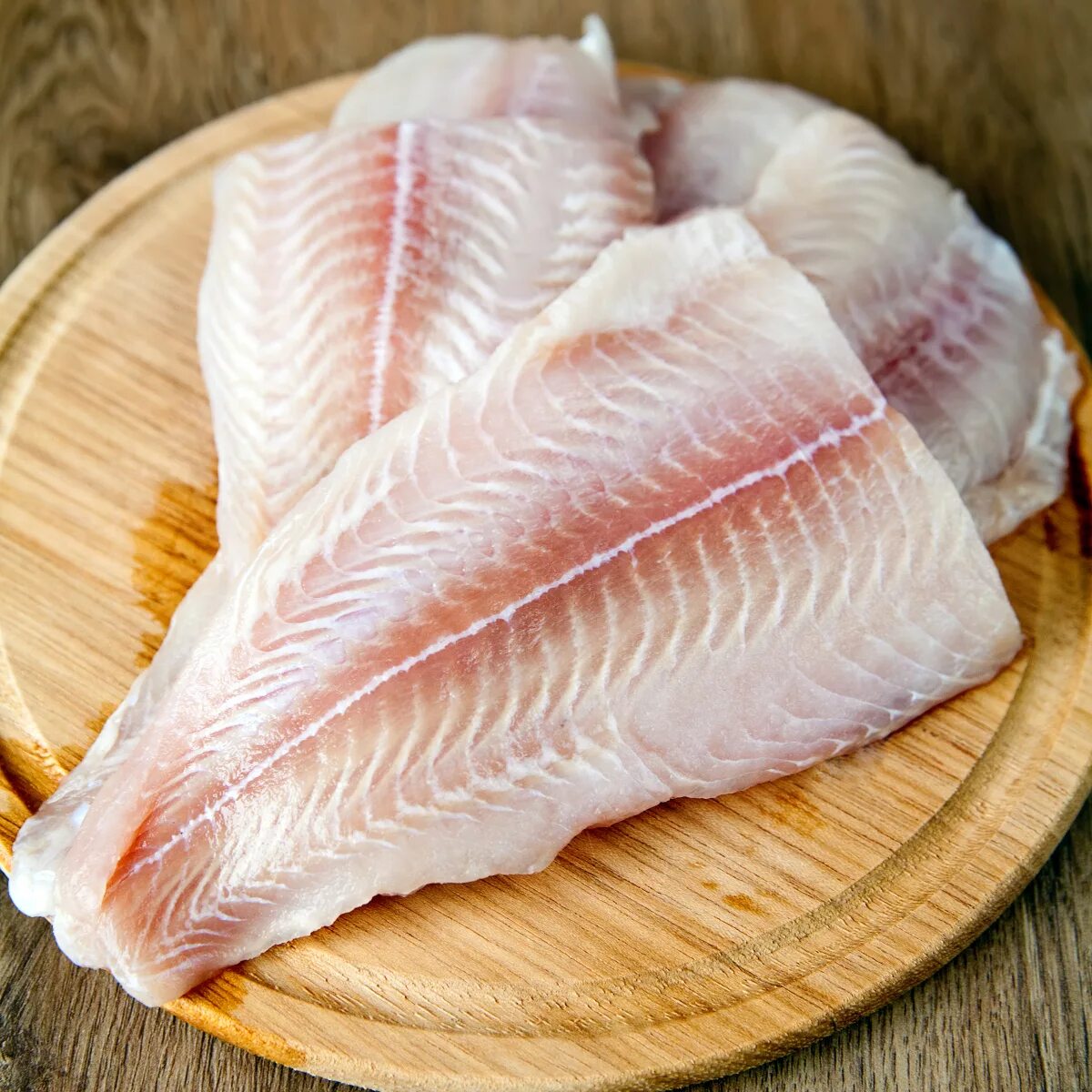 Белая рыба пангасиус. Филе рыбы пангасиус. Рыбное филе пангасиуса. Пангасиус. Филе пангасиуса с/м вес.