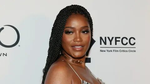 Getty Images. headshot of keke palmer with black twists and glam makeup. 