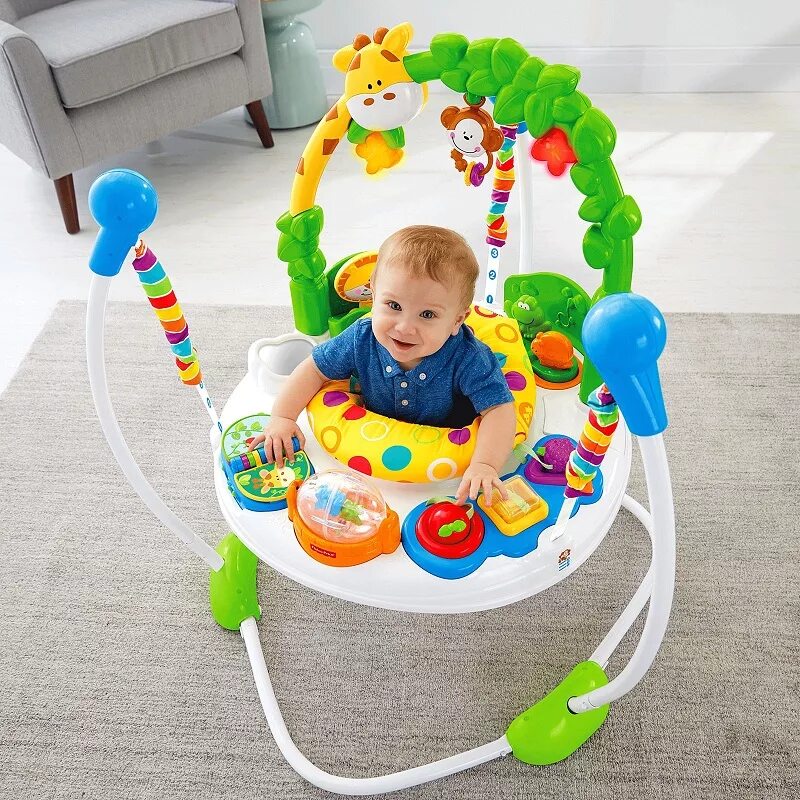 Во сколько можно ребенка сажать в ходунки. Jumperoo Fisher Price. Игровой центр прыгунки Fisher Price. Ходунки для малышей. Детские ходунки для малышей.