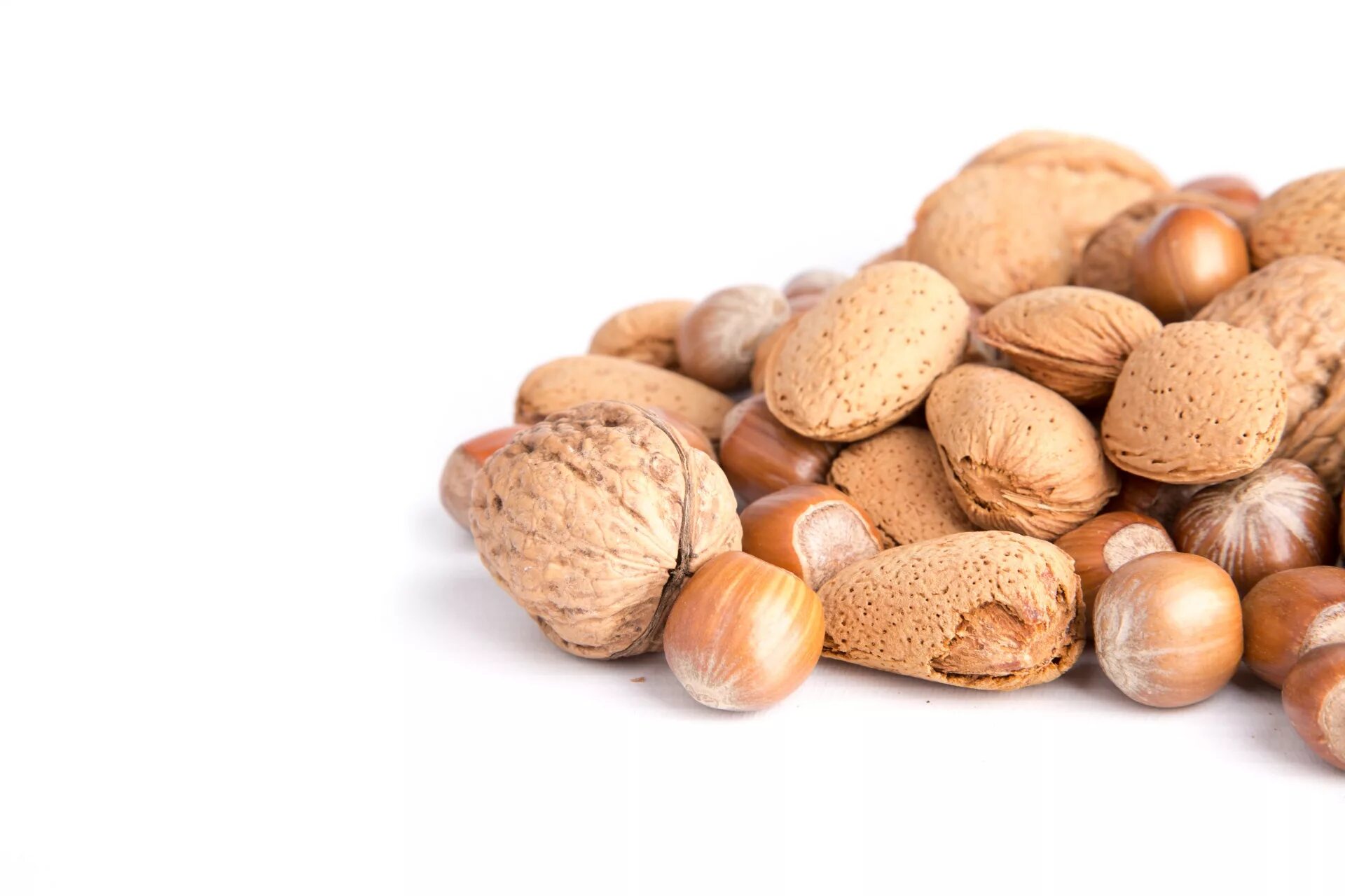 Background of nuts - pecan, macadamia, brazil nut, walnut, almonds, hazelnuts, p