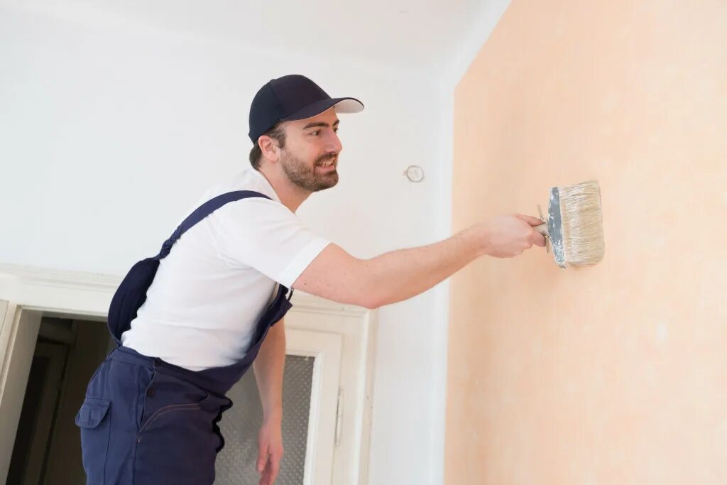 When the walls paint. Wall worker. wall painting man.