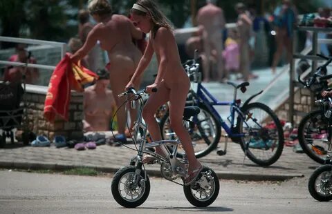 Purenudism Images-Biking At Edge Of The Pool - 3.