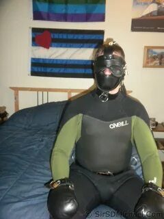 Wet suit bondage.