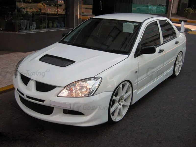 Lancer 9. Mitsubishi evo 9 widebody. Mitsubishi lancer ix 2005. Mitsubishi lancer 2006 evo style. Обвес на митсубиси лансер 9.