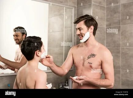 laughing son and dad applying shaving foam in bathroom Stock Photo - Alamy.