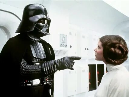 David Prowse as Darth Vader and Carrie Fisher as Princess Le