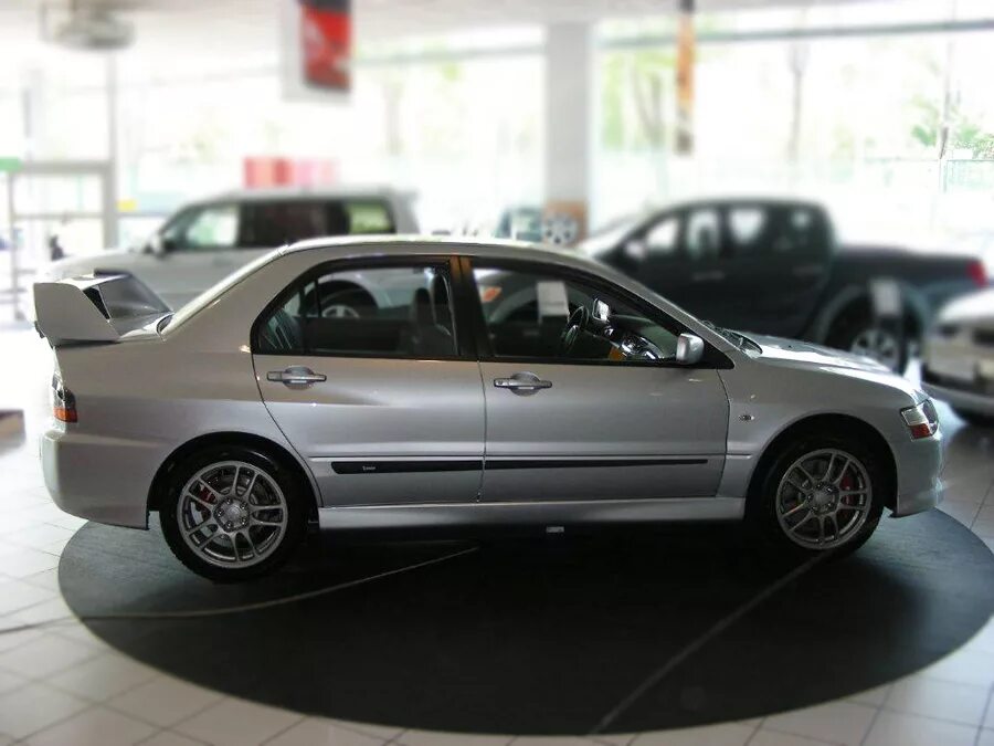 кронштейн крепления глушителя лансер 9. гайка подрамника лансер 9. артикул болта стойки mitsubishi lancer 9. держатель акб mitsubishi pajero sport. изофикс логан 1.